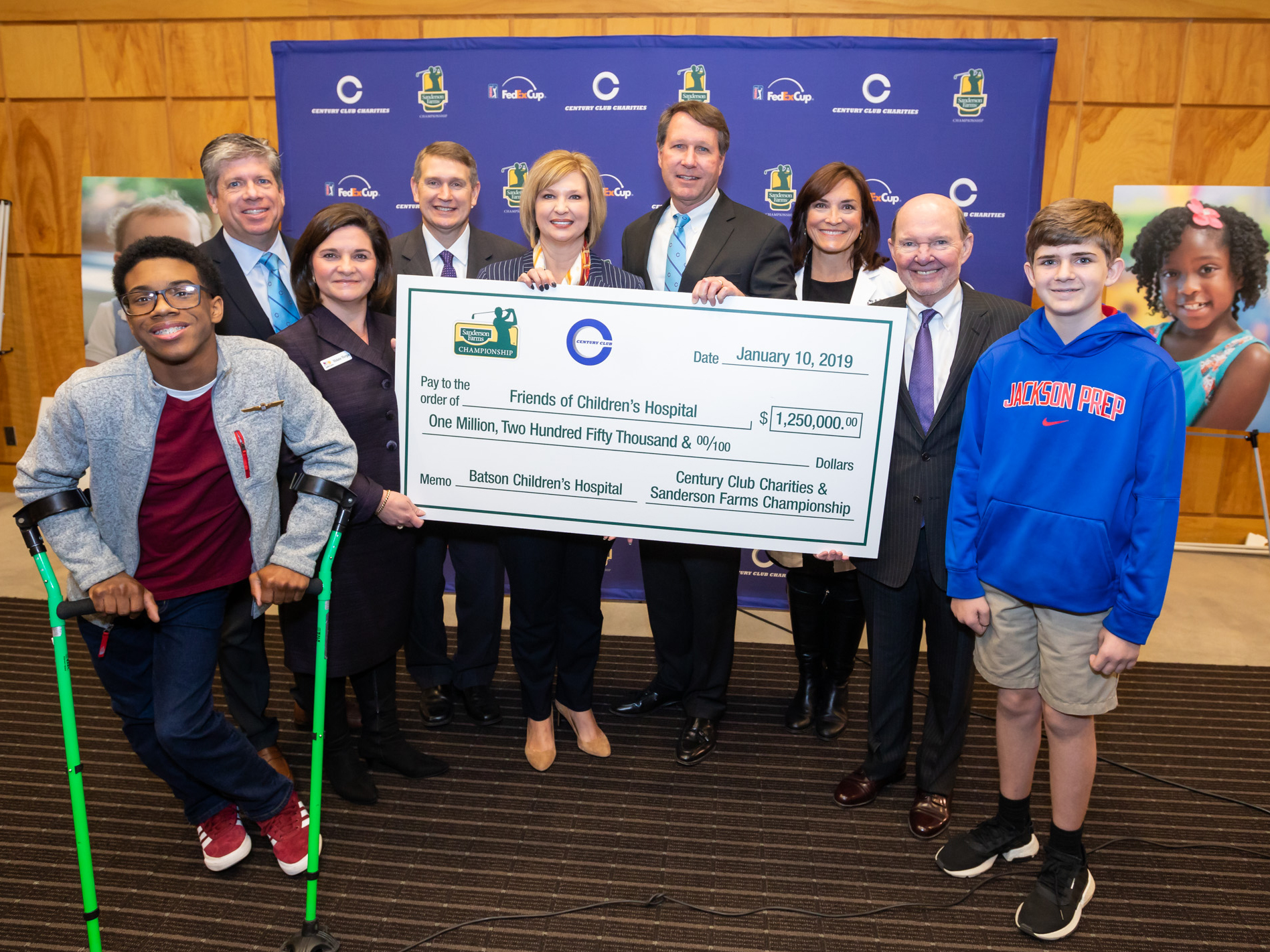 Celebrating a $1.25 million donation from Century Club Charities are, from left, Children's of Mississippi patient Jordan Morgan, Steve Jent, Melanie Morgan, Guy Giesecke, Dr. LouAnn Woodward, Jeff Hubbard, Dr. Mary Taylor, Sanderson Farms CEO and board chair Joe Sanderson Jr. and patient Felton Walker.